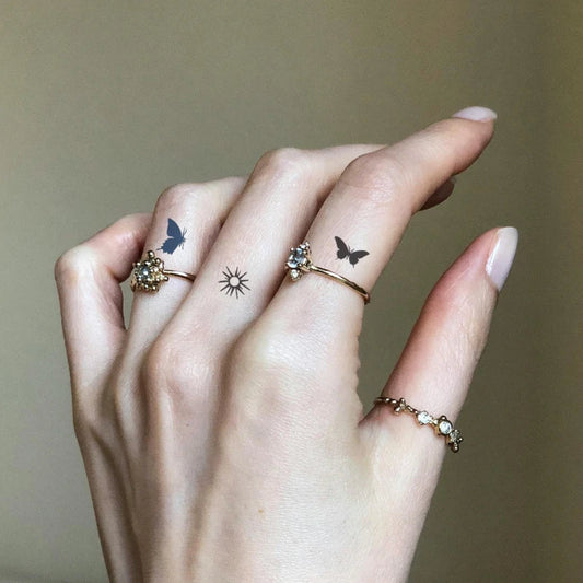 Butterfly Finger Tattoo