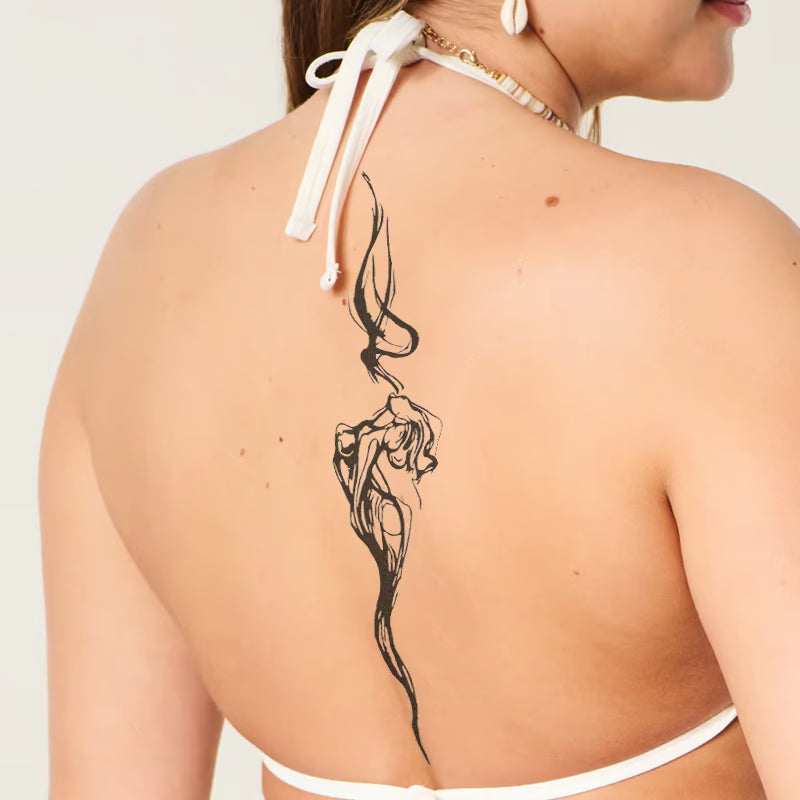 Elegant Smoke Figure Tattoo