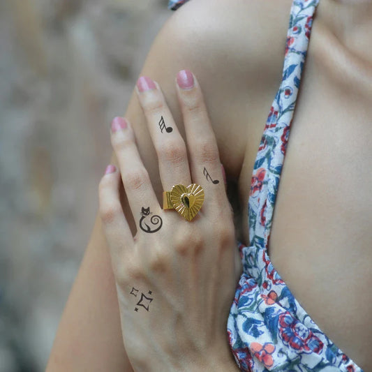Music Note Finger Tattoo