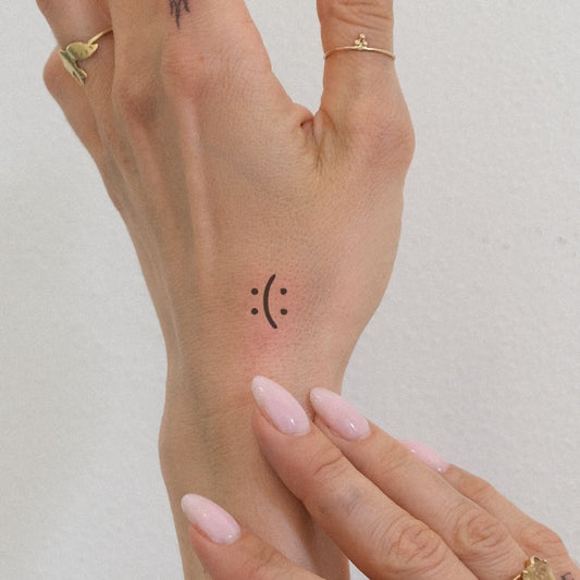 Sad Face Emoji Tattoo